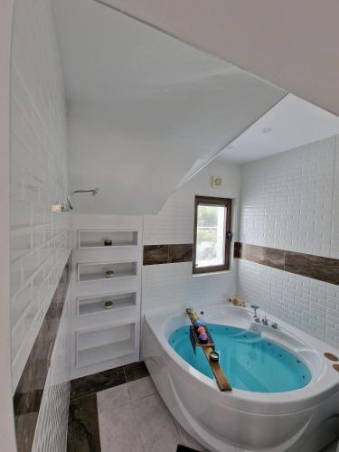 a bathroom with a large tub in a room at Bodega Otel Şile in Şile