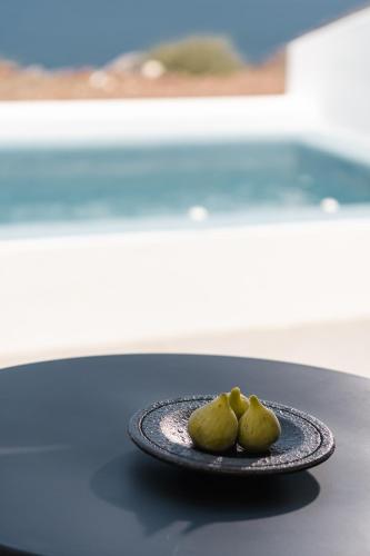 two food items on a plate on a table at El Destino Suites in Akrotiri