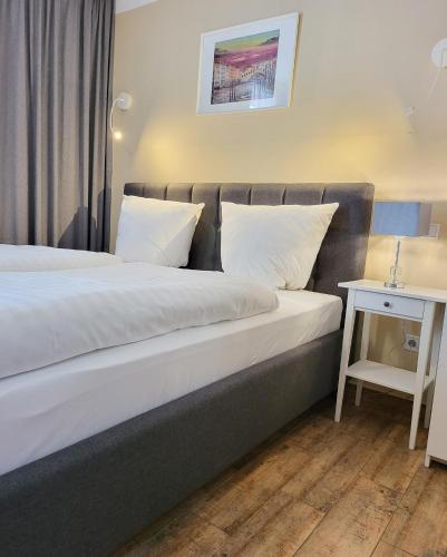 Llit o llits en una habitació de Marcel Apartments Leipzig