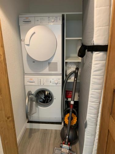 a washer and dryer in a small room at Allegra Appenzell in Trogen
