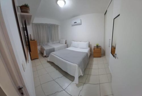 Ein Bett oder Betten in einem Zimmer der Unterkunft Belo flat em Pontal Beach Resort - Recreio