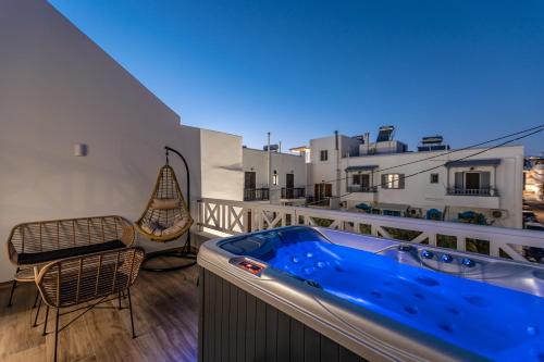 a hot tub on the balcony of a apartment at Heavenly Suites & Studios in Naxos Chora