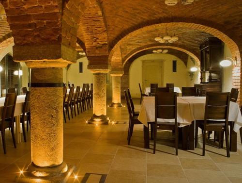 a dining room with tables and chairs in a building at Katarzynka in Boleścin