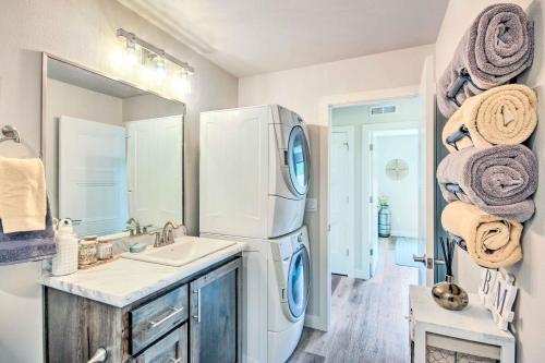 a bathroom with a sink and a refrigerator at Red Lodge Home with Patio about 1 Mi from Downtown! in Red Lodge