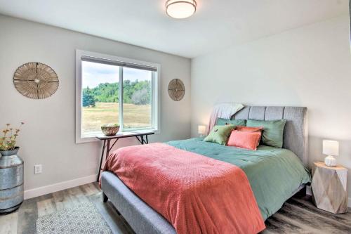 a bedroom with a bed and a window at Red Lodge Home with Patio about 1 Mi from Downtown! in Red Lodge