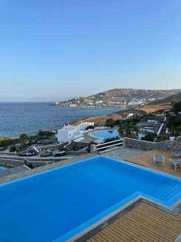 a swimming pool with a view of the ocean at Salty Blè in Agios Ioannis Mykonos
