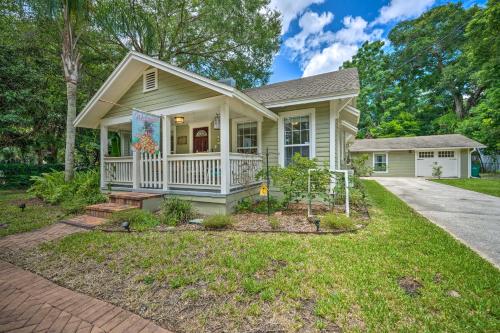 a small house with a porch and a yard at Walk to Mount Dora Historic District Cozy Home! in Mount Dora