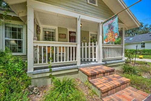a front porch of a house with a white fence at Walk to Mount Dora Historic District Cozy Home! in Mount Dora