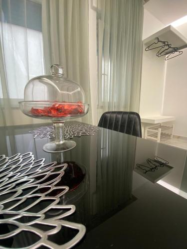 a glass table with a bowl on top of it at Maison De luxe in Pompei