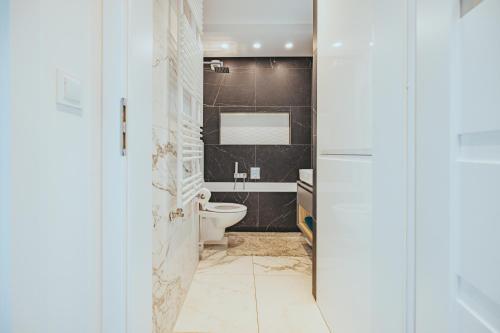 Kúpeľňa v ubytovaní Apartament Szlachecka