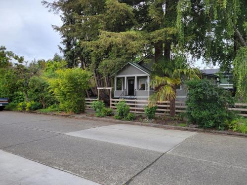 a white house with a porch and a driveway at Modern Craftsman Garden Patio in Georgetown in Seattle