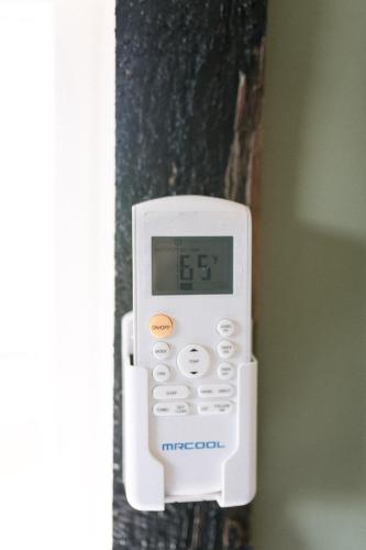 a thermometer hanging on the side of a wall at The Outpost in Grand Rivers