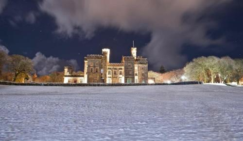 a large castle in the middle of a snow covered field at BAYVIEW in Stornoway