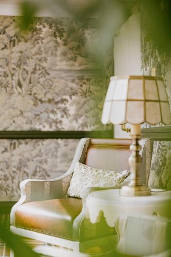 a lamp sitting on a table next to a couch at Marine Troon in Troon