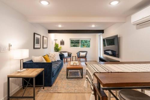 a living room with a couch and a table at Artistic Georgetown Retreat in Seattle in Seattle
