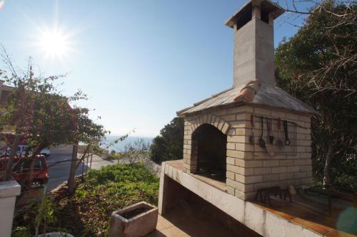a brick oven on the side of a house at Apartments by the sea Zavalatica, Korcula - 247 in Zavalatica