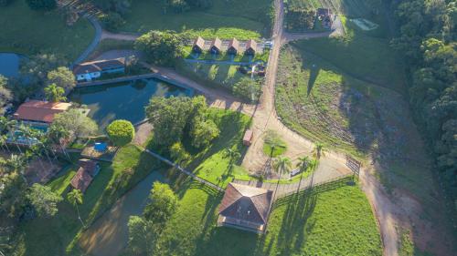 an aerial view of a mansion with a pond at Pousada Scursel in Ibirama