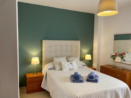 a bedroom with a bed with towels on it at Tranquilidad y Relax in Torrox Costa