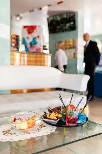 a tray of food on a glass table at Hotel Margareth in Riccione