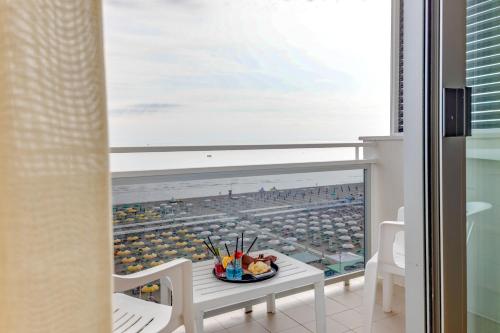 a room with a table and a view of a stadium at Hotel Margareth in Riccione