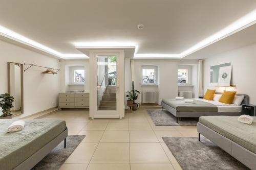 a living room with two beds and a couch at Spacious apartment in Hemholtzkiez Prenzlauer Berg for 8 People in Berlin