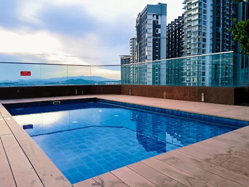 a swimming pool on the roof of a building at Afiniti, 2 min walk to legoland and Gleneagles Hospital By Hint Homestay in Nusajaya