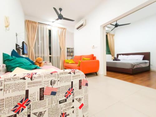 a living room with a bed and a couch at Afiniti, 2 min walk to legoland and Gleneagles Hospital By Hint Homestay in Nusajaya