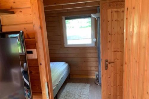 Postel nebo postele na pokoji v ubytování Bezauberndes Ferienhaus mitten in der Natur.