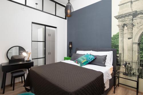 מיטה או מיטות בחדר ב-Apartment Deluxe Ana