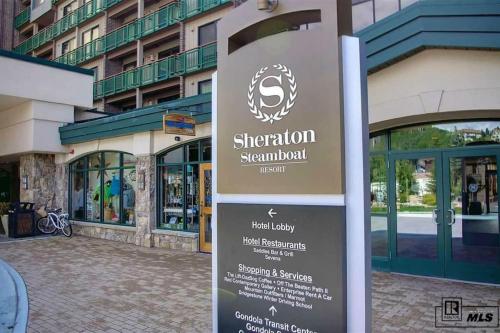 a sign in front of a building at Penthouse Ski-In Ski-Out Above Sheraton 1bd 1.5ba in Steamboat Springs