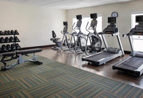 a gym with several exercise bikes and treadmills at Holiday Inn Express & Suites - El Paso North by IHG in El Paso