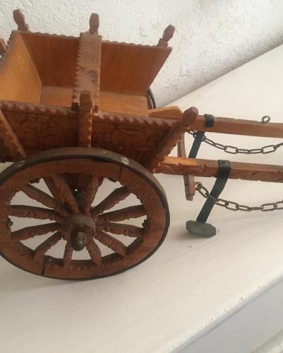 a wooden cart hanging from a ceiling at House Il Conte in Palermo