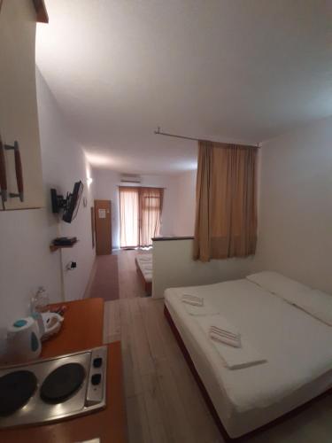 Ένα ή περισσότερα κρεβάτια σε δωμάτιο στο Apartments Aurora