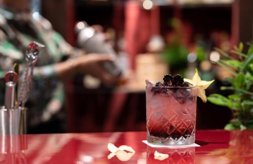 a drink on a table with a star on it at Leonardo Royal Hotel Venice Mestre in Mestre