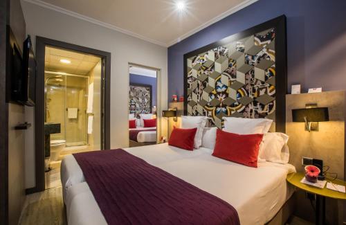 Letto o letti in una camera di Leonardo Hotel Barcelona Las Ramblas