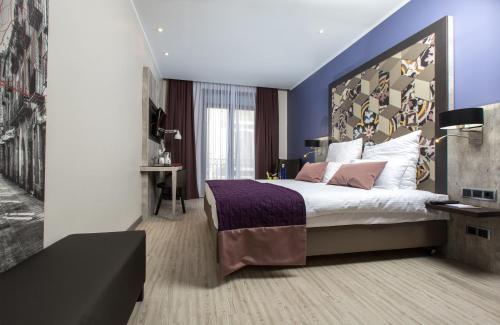 Letto o letti in una camera di Leonardo Hotel Barcelona Las Ramblas