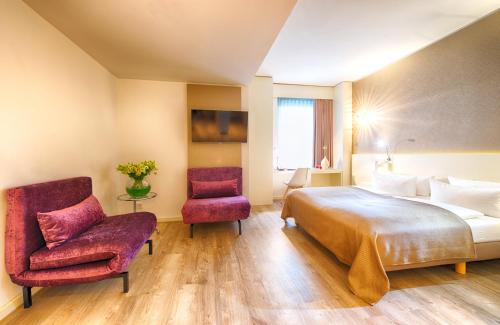 Postel nebo postele na pokoji v ubytování Leonardo Hotel Berlin Mitte