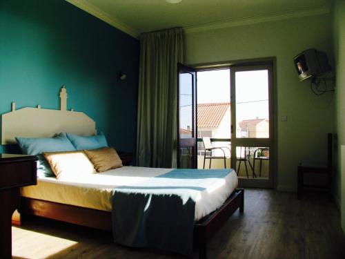 Postel nebo postele na pokoji v ubytování Hotel Areias Claras