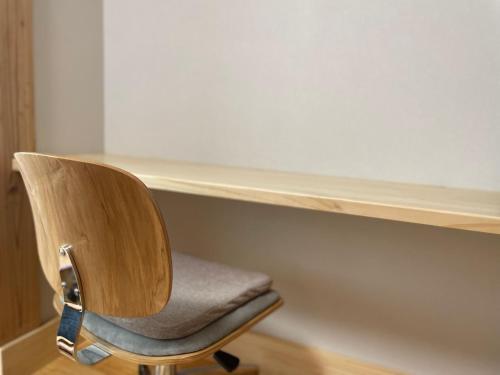 a chair sitting in front of a desk at Marushige in Nozawa Onsen