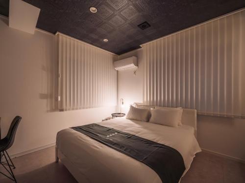 Postel nebo postele na pokoji v ubytování INFINITY HOTEL -jicchaku-
