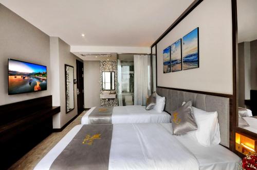 Katil atau katil-katil dalam bilik di Ivy Hotel Nha Trang