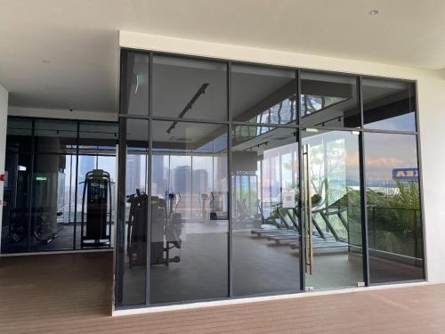 a large glass building with a view of the city at Lucky Continew Residence 1 Bedroom - TRX KL in Kuala Lumpur
