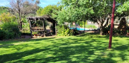a yard with a gazebo and a swimming pool at Talbot - Rustic style accommodation with Mod Cons in Hoddy Well