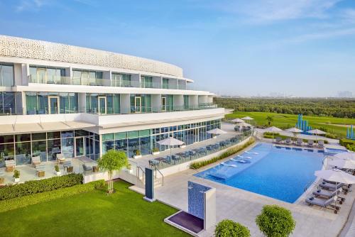 an aerial view of a building with a swimming pool at Zoya Health & Wellbeing Resort in Ajman