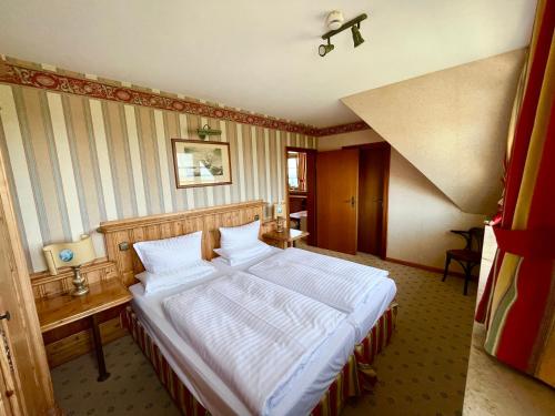 Moby Dick Hotel & Ferienwohnungenにあるベッド