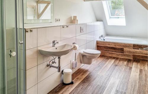 a bathroom with a sink and a toilet at 2 Bedroom Beach Front Apartment In Passow Ot Charlottenho in Zahren