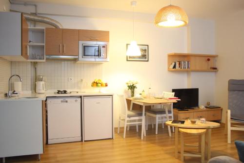 a kitchen and dining room with a table and a kitchen and a kitchen at TownHouse Istanbul in Istanbul