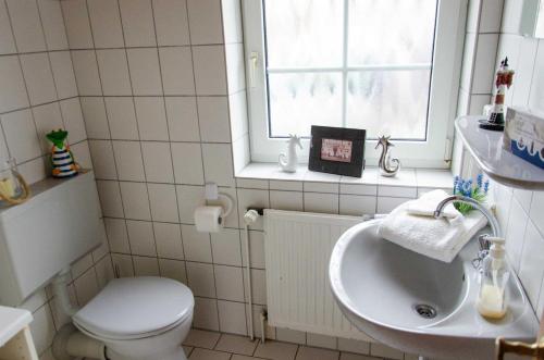 Koupelna v ubytování Ferienhaus Seewiefken