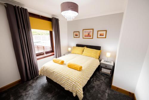 מיטה או מיטות בחדר ב-Glen Nevis View