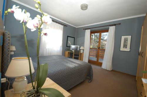 Postel nebo postele na pokoji v ubytování Hotel Des Geneys